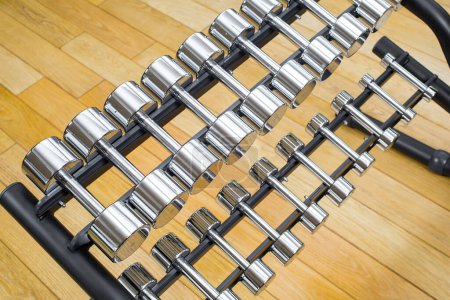 Photo for Dumbbells in modern sports club. Weight Training Equipment - Royalty Free Image