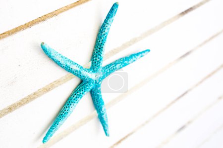 Photo for Starfish on wooden background - Royalty Free Image