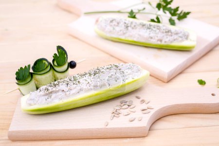 Photo for Cucumber Stuffed with Feta, Herbs, Sunflower seeds, Sour Cream and dill - Royalty Free Image