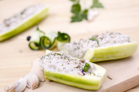 Photo for Cucumber Stuffed with Feta, Herbs, Sunflower seeds, Sour Cream and dill - Royalty Free Image