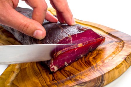 Photo for Smoked beef ham on a chopping board. - Royalty Free Image