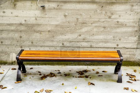 Photo for Empty wooden bench outdoors - Royalty Free Image