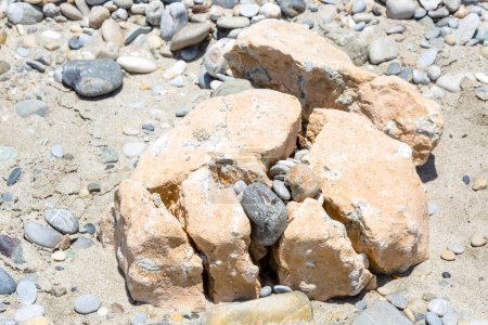 Photo for Lots of little stones broke a big rocks - Royalty Free Image