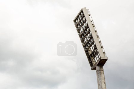 Photo for Large tall high outdoor stadium spotlights on rigid frame construction under natural sunlight, die-cut isolated on white background - Royalty Free Image