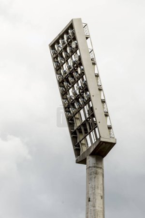 Photo for Large tall high outdoor stadium spotlights on rigid frame construction under natural sunlight, die-cut isolated on white background - Royalty Free Image
