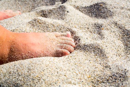 Photo for Two children feet in the sand - Royalty Free Image