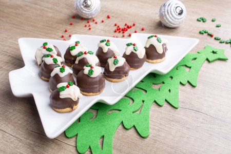 Photo for Christmas cupcake. Cakes in the plate form of Christmas tree fir - Royalty Free Image