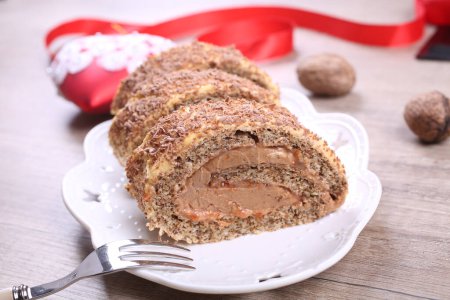 Photo for Chocolate yule log cake on plate - Royalty Free Image