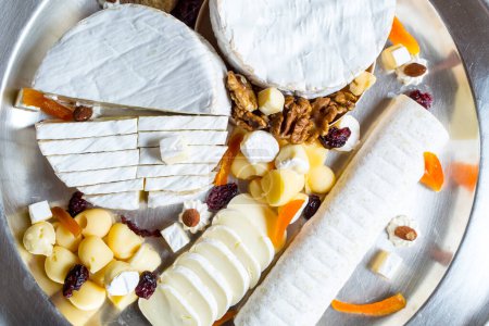 Photo for Various types of cheese with spice on a plate - Royalty Free Image