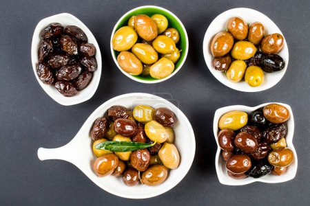 Photo for Set of olives in bowls on table - Royalty Free Image