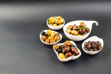 Photo for Set of olives in bowls on table - Royalty Free Image