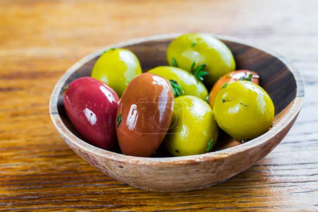 Photo for Different olive fruits on wooden backgrounds - Royalty Free Image