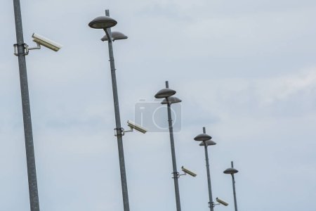 Photo for Security cameras on a post over clear sky background - Royalty Free Image