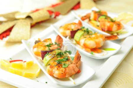 Photo for Skewered Prawns with Vegetables on plate - Royalty Free Image