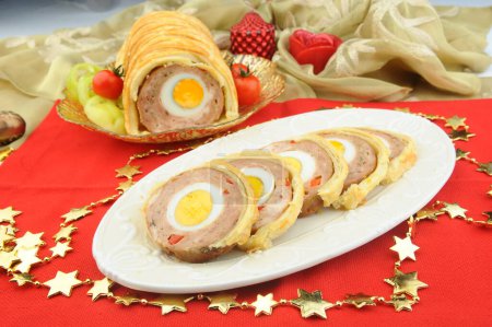 Photo for Rolled meat with eggs in puff dough - Royalty Free Image