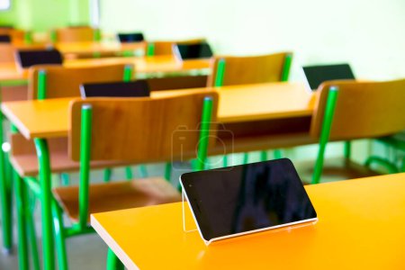 Photo for Digital tablets on the desks in classroom - Royalty Free Image