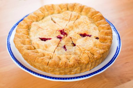 Photo for Delicious homemade raspberries pie with maffins top view - Royalty Free Image