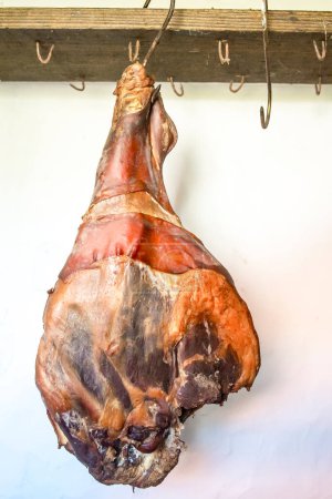 Photo for Domestic smoked meat. Dry ham in pantry - Royalty Free Image