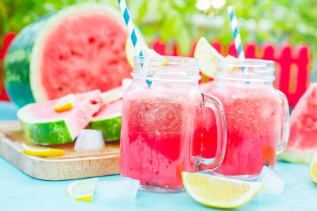 Photo for Watermelon juice in glasses on table - Royalty Free Image