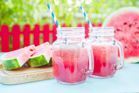 Photo for Watermelon juice in glasses on table - Royalty Free Image