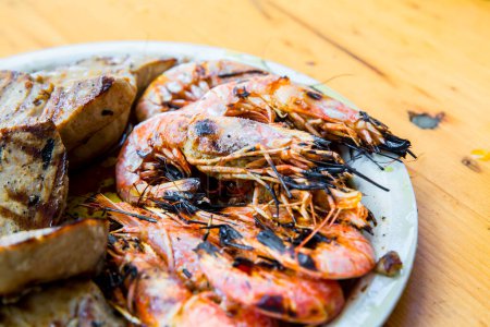 Photo for Tasty shrimps on a plate on table - Royalty Free Image