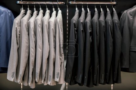 Photo for Row of men suits on hangers - Royalty Free Image