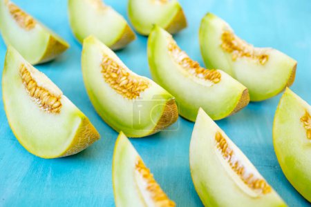 Photo for Fresh sweet green melon on the wooden table - Royalty Free Image