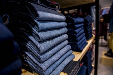 Photo for Stack of blue jeans in a shop - Royalty Free Image