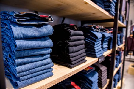 Photo for Stack of blue jeans in a shop - Royalty Free Image