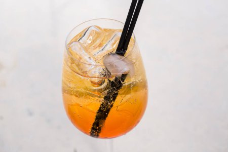 Photo for Orange cocktail with ice and orange slices - Royalty Free Image