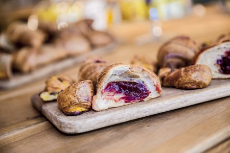 Photo for Sweet croissants on a wooden board - Royalty Free Image