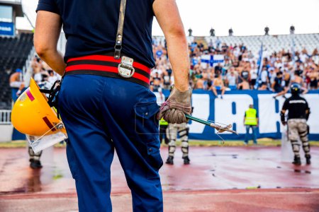 Photo for Firefighters with uniform in the Stadium during the soccer event - Royalty Free Image