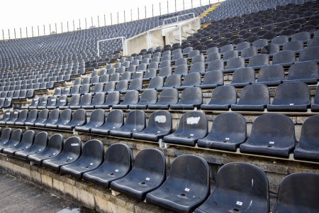 Photo for Empty tribunes with seats on soccer stadium - Royalty Free Image