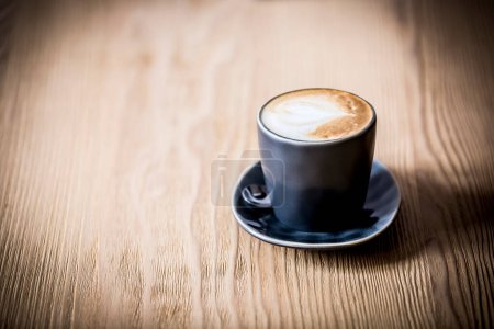 Photo for Cup of coffee on wooden table - Royalty Free Image