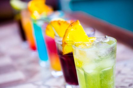 Photo for Colorful cocktails with ice in glasses - Royalty Free Image