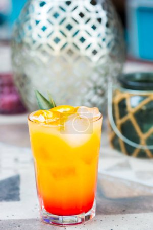 Photo for Cocktail with orange juice and ice cubes. Tequila sunrise - Royalty Free Image