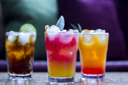 Photo for Three colorful cocktails on table - Royalty Free Image