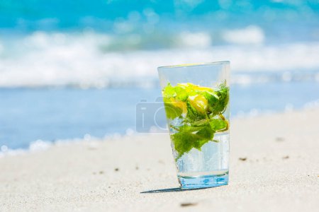 Photo for Summer mohito drink with blur beach on background - Royalty Free Image
