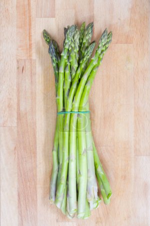 Photo for Close up of asparagus on wooden board - Royalty Free Image