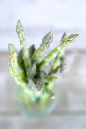 Photo for Green asparagus on blurred background - Royalty Free Image