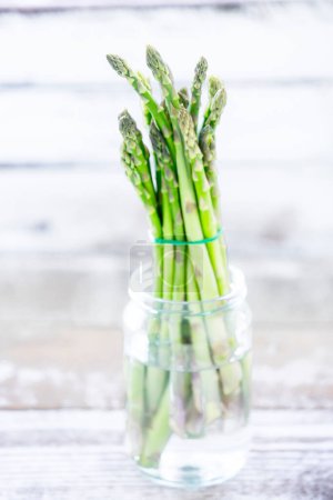 Photo for Green asparagus on blurred background - Royalty Free Image