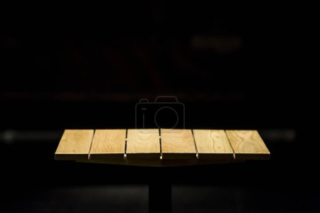 Photo for Wood table and black background - Royalty Free Image
