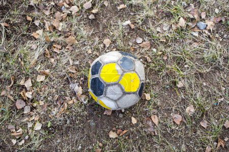 Photo for Old soccer ball on a football field. - Royalty Free Image