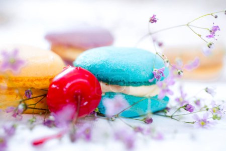 Photo for Colorful French Macaroons with cherry - Royalty Free Image