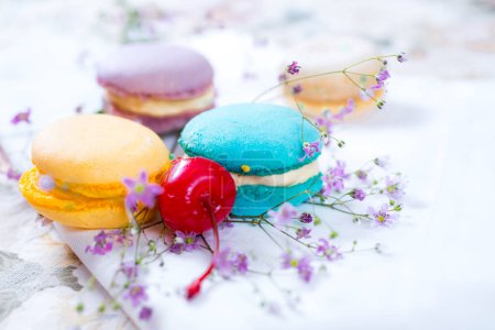 Photo for Colorful French Macaroons with cherry - Royalty Free Image