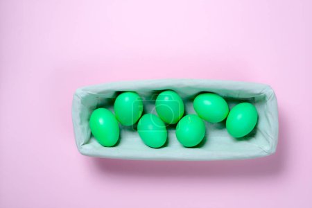 Photo for Green easter eggs in basket - Royalty Free Image