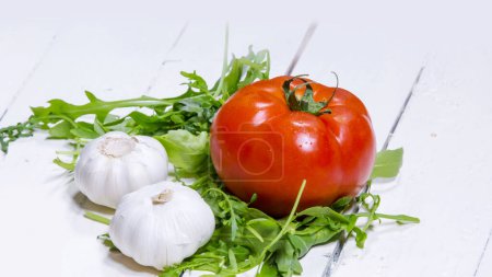 Photo for Tomato and garlic on wooden background - Royalty Free Image