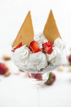 Photo for Sweet ice cream with strawberries in glass - Royalty Free Image