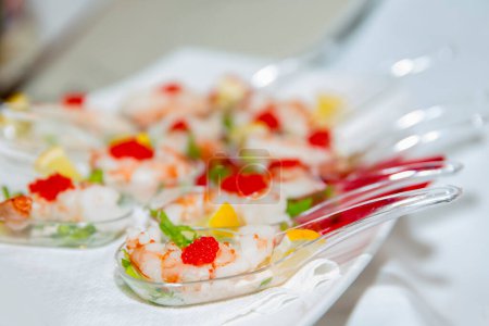 Photo for Canape of shrimp with lemon and red caviar - Royalty Free Image