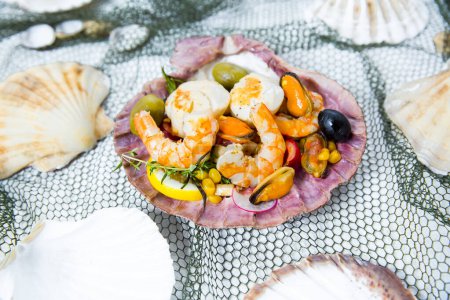 Photo for Seafood Salad with shrimp, mussels, scallops in the shell - Royalty Free Image